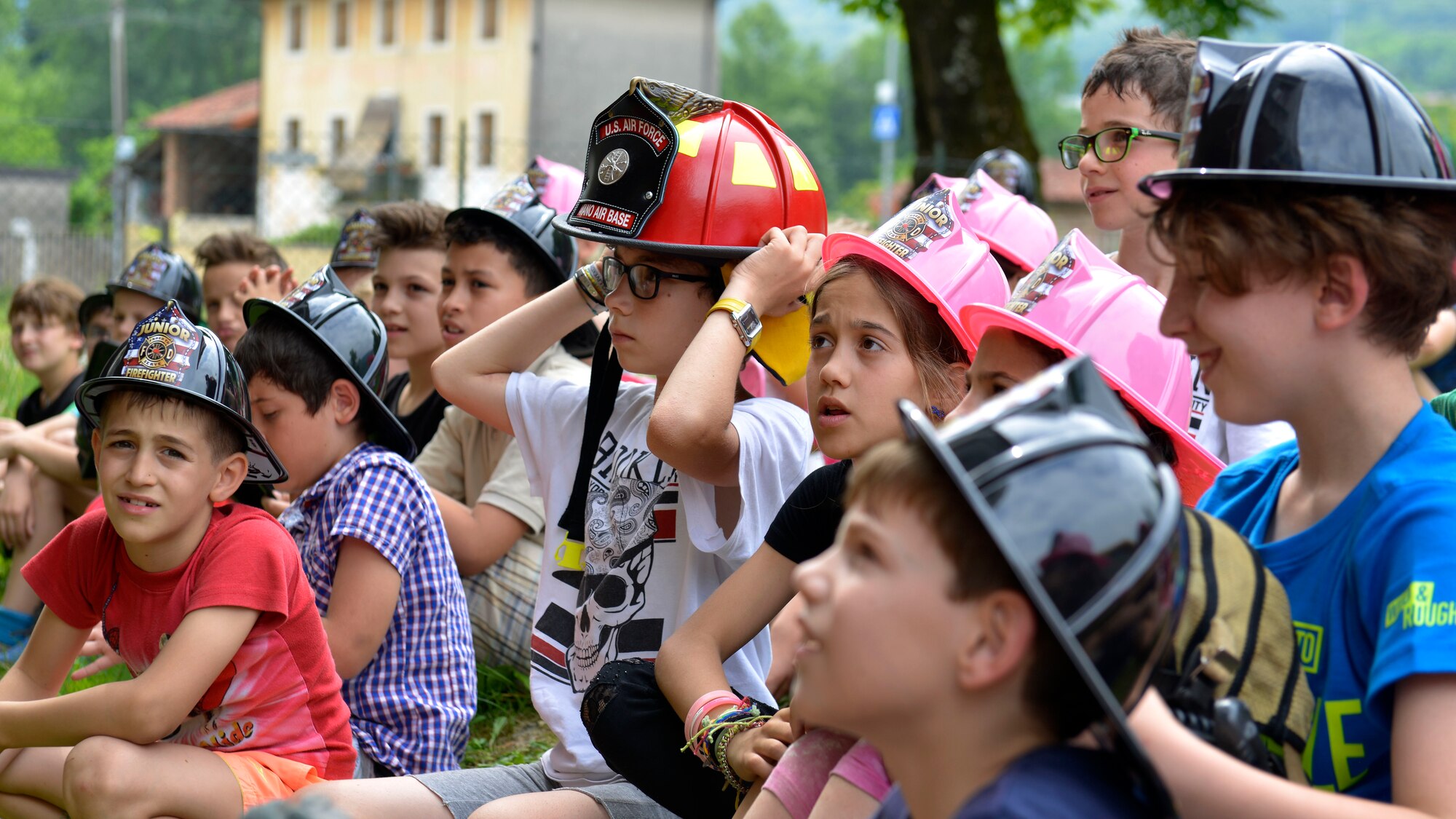 Italian children listen to a fire safety demonstration, May 31, 2017 in Polcinego, Italy. Members of the 31st Civil Engineer Squadron Fire Department visited the school to show the children firefighting equipment and teach fire safety. (U.S. Air Force photo by Senior Airman Cary Smith)