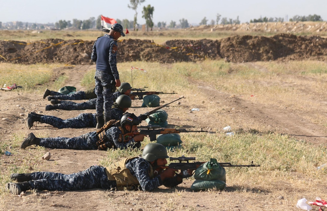 An Iraqi Federal Police sniper instructor supervises trainees during an Iraqi security forces-led course, supported by advisers from Combined Joint Task – Force Operation Inherent Resolve, near Mosul, Iraq, May 16, 2017. The advisers, assigned to the 2nd Brigade Combat Team, 82nd Airborne Division, enable their Iraqi security force partners through the advise and assist mission, contributing planning, intelligence collection and analysis, force protection, and precision fires to achieve the military defeat of ISIS. CJTF-OIR is the global Coalition to defeat ISIS in Iraq and Syria. (U.S. Army photos by Sgt. Brandon L. Rizzo)