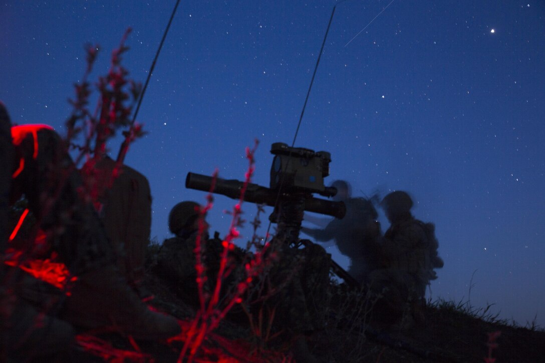 Marines with 3rd Air Naval Gunfire Liaison Company, Force Headquarters Group, Marine Forces Reserve, and Canadian Soldiers from 2 Royal Canadian Regiment search for possible enemy targets at night May 26, 2017, during exercise Maple Resolve 2017, to provide surface-to-surface as well as air-to-surface fire support. Exercise Maple Resolve is an annual, 3-week multinational simulated war, hosted by the Canadian Army bringing approximately 7,000 total NATO allies across the world to share tactics while strengthening foreign military ties.