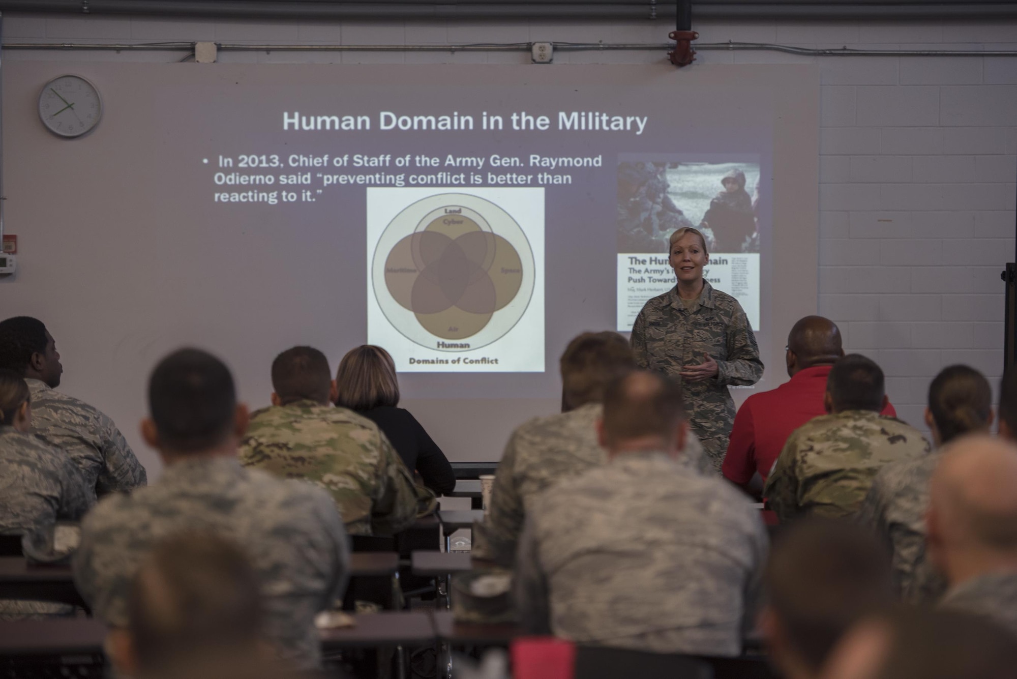 Chief Master Sgt. Candace Smith, Profession of Arms Center of Excellence superintendent, Joint Base San Antonio-Randolph, Texas, briefs Team Moody members during a PACE presentation, May 19, 2017, at Moody Air Force Base, Ga. PACE encourages Airmen to commit to the mindset, character and core values required to succeed today and well into the future. During the visit, Smith challenged Moody Airmen to successfully change their perspectives to find solutions to old problems as leaders. (U.S. Air Force photo by Senior Airman Greg Nash)