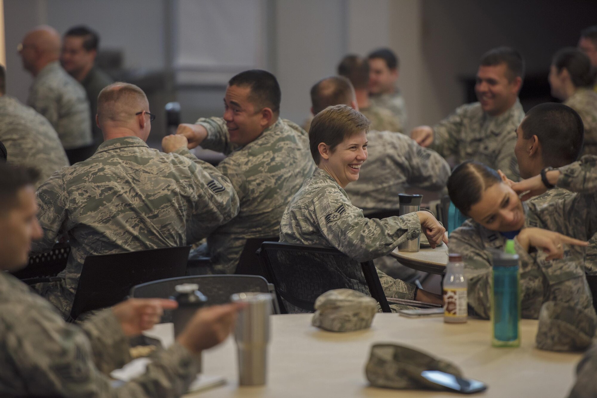 Team Moody members share a laugh during a group activity as part of a visit from  Joint Base San Antonio-Randolph, Texas’s, Profession of Arms Center of Excellence, May 19, 2017, at Moody Air Force Base, Ga. PACE encourages Airmen to commit to the mindset, character and core values required to succeed today and well into the future. During the visit, Smith challenged Moody Airmen to successfully change their perspectives to find solutions to old problems as leaders. (U.S. Air Force photo by Senior Airman Greg Nash)
