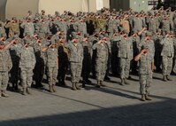 380th Air Expeditionary Wing Airmen salute the U.S. flag as it is lowered during a monthly retreat ceremony June 2, 2017, at an undisclosed location in southwest Asia. Retreat is a long-standing tradition honoring the flag and signaling the end of the duty day. (U.S. Air Force photo by Senior Airman Preston Webb)