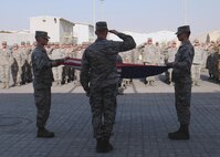 380th Air Expeditionary Wing honor guardsmen prepare to fold the U.S. flag during a monthly retreat ceremony June 2, 2017, at an undisclosed location in southwest Asia. A retreat ceremony, in which the U.S. flag is retired, takes place here on the first Friday of every month. (U.S. Air Force photo by Senior Airman Preston Webb)