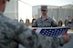 380th Air Expeditionary Wing honor guardsmen prepare to fold the U.S. flag during a monthly retreat ceremony June 2, 2017, at an undisclosed location in southwest Asia. A retreat ceremony, in which the U.S. flag is retired, takes place here on the first Friday of every month. (U.S. Air Force photo by Senior Airman Preston Webb)