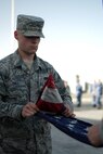 A 380th Air Expeditionary Wing honor guardsman folds the U.S. flag during a monthly retreat ceremony June 2, 2017, at an undisclosed location in southwest Asia. A retreat ceremony, in which the U.S. flag is retired, takes place here on the first Friday of every month. (U.S. Air Force photo by Senior Airman Preston Webb)