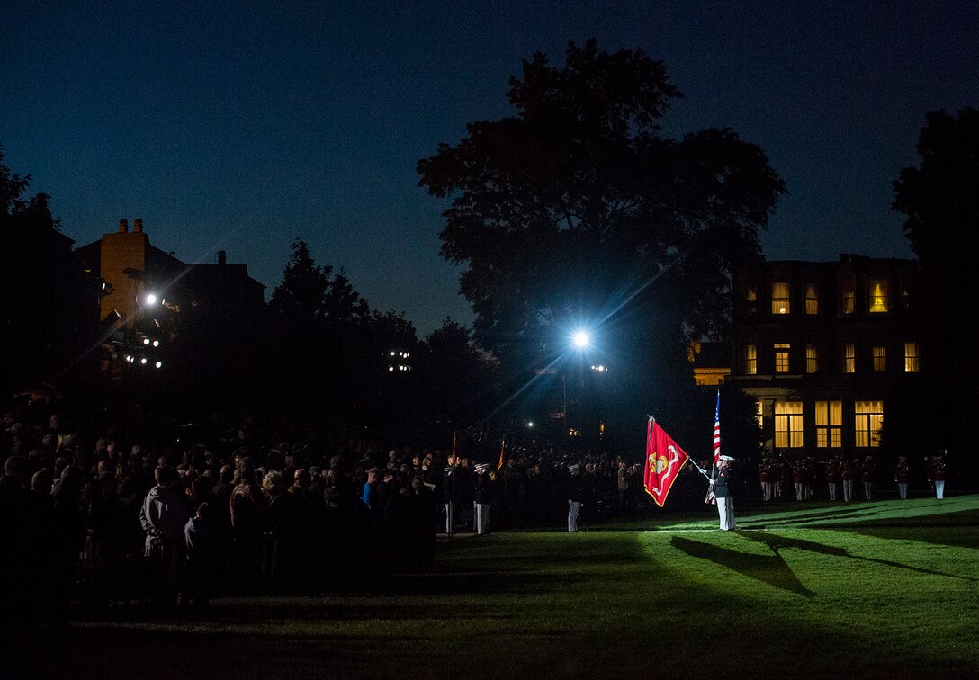 The U.S. Marine Color Guard renders honors for the National Anthem during a Friday Evening Parade at Marine Barracks Washington D.C., May 26, 2017. The guests of honor for the parade were Ms. Bonnie Carroll, president and founder, Tragedy Assistance Program for Survivors (TAPS), Sgt. Tim Parrish, TAPS, Mr. Carlos Arredondo, TAPS, Ms. Taylor Dudley, TAPS, Ms. Melissa Kasinger, TAPS, and Ms. Katherine Stanley, TAPS. The hosting official for the parade was Gen. Joseph F. Dunford Jr., chairman of the Joint Chiefs of Staff. (Official Marine Corps photo by Cpl. Robert Knapp/Released)
