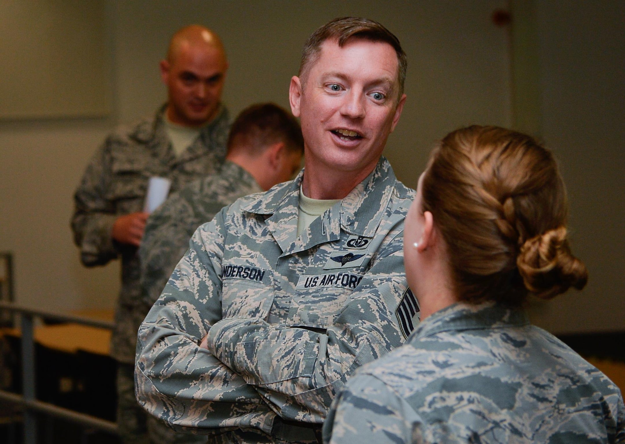 U.S. Air Force Chief Master Sgt. George Anderson, Headquarters U.S. Air Forces in Europe and Air Forces Africa first sergeant, speaks with a company grade officer during a professional development seminar on Ramstein Air Base, Germany, June 1, 2017. First sergeants conducted the seminar CGOs in order to help them strengthen their leadership skills. (U.S. Air Force photo by Airman 1st Class Joshua Magbanua)