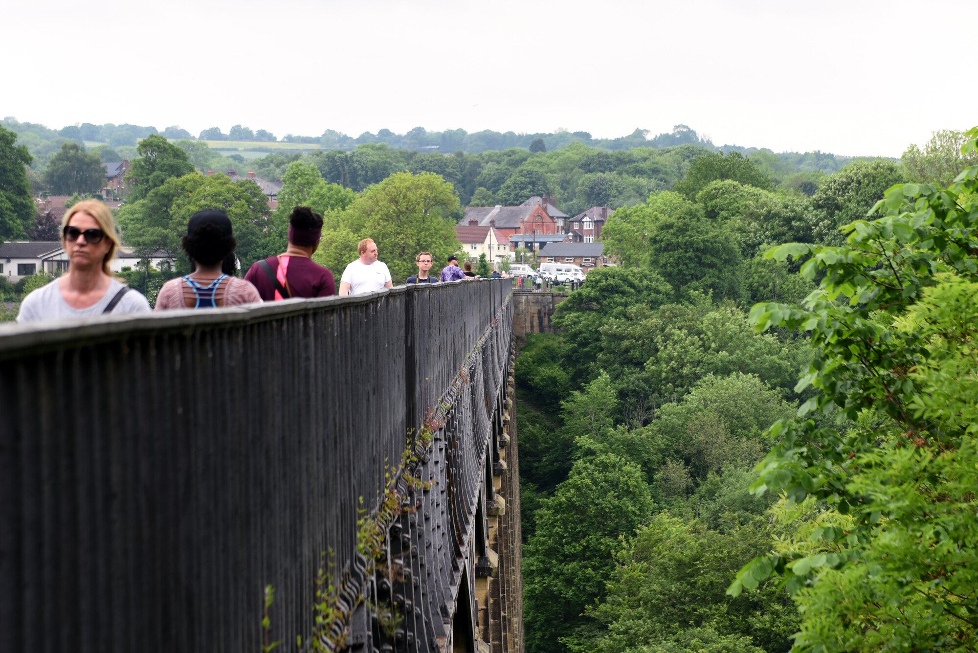U.S. Air Force Airmen from Royal Air Force Lakenheath, England walk along the top of the Pontcysyllte Aqueduct during a chapel-sponsored resiliency trip to Trevor Basin, Wales, May 27. The trip was for first-term single Airmen to work toward resiliency goals and to build friendships with other Airmen. (U.S. Air Force photo by Airman 1st Class John A. Crawford)