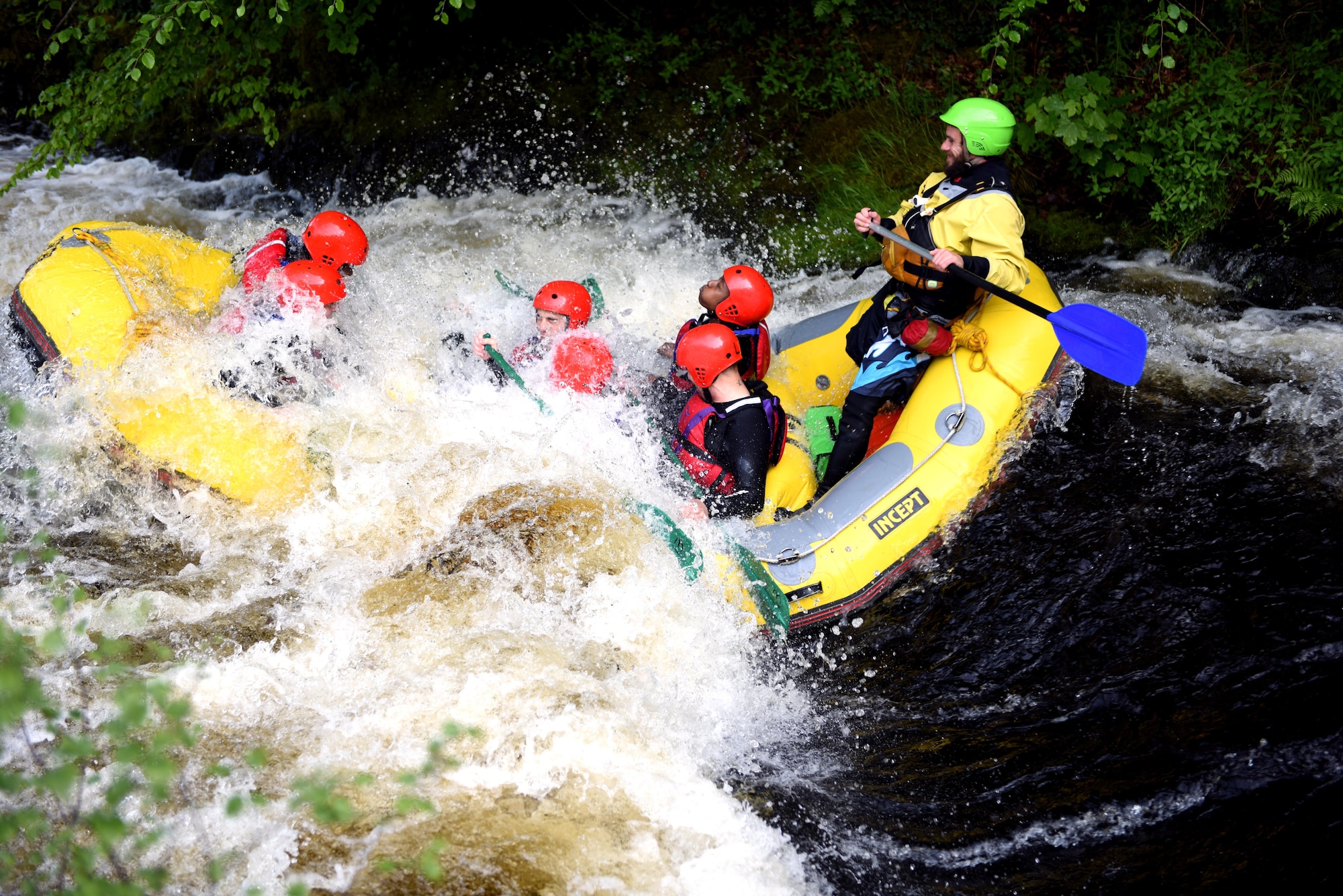 U.S. Air Force Airmen from Royal Air Force Lakenheath, England white-water raft during a chapel-sponsored resiliency trip to the National White Water Centre in Frongoch, Wales, May 28. The trip was for first-term single Airmen to work toward resiliency goals and to build friendships with other Airmen. (U.S. Air Force photo by Airman 1st Class John A. Crawford)
