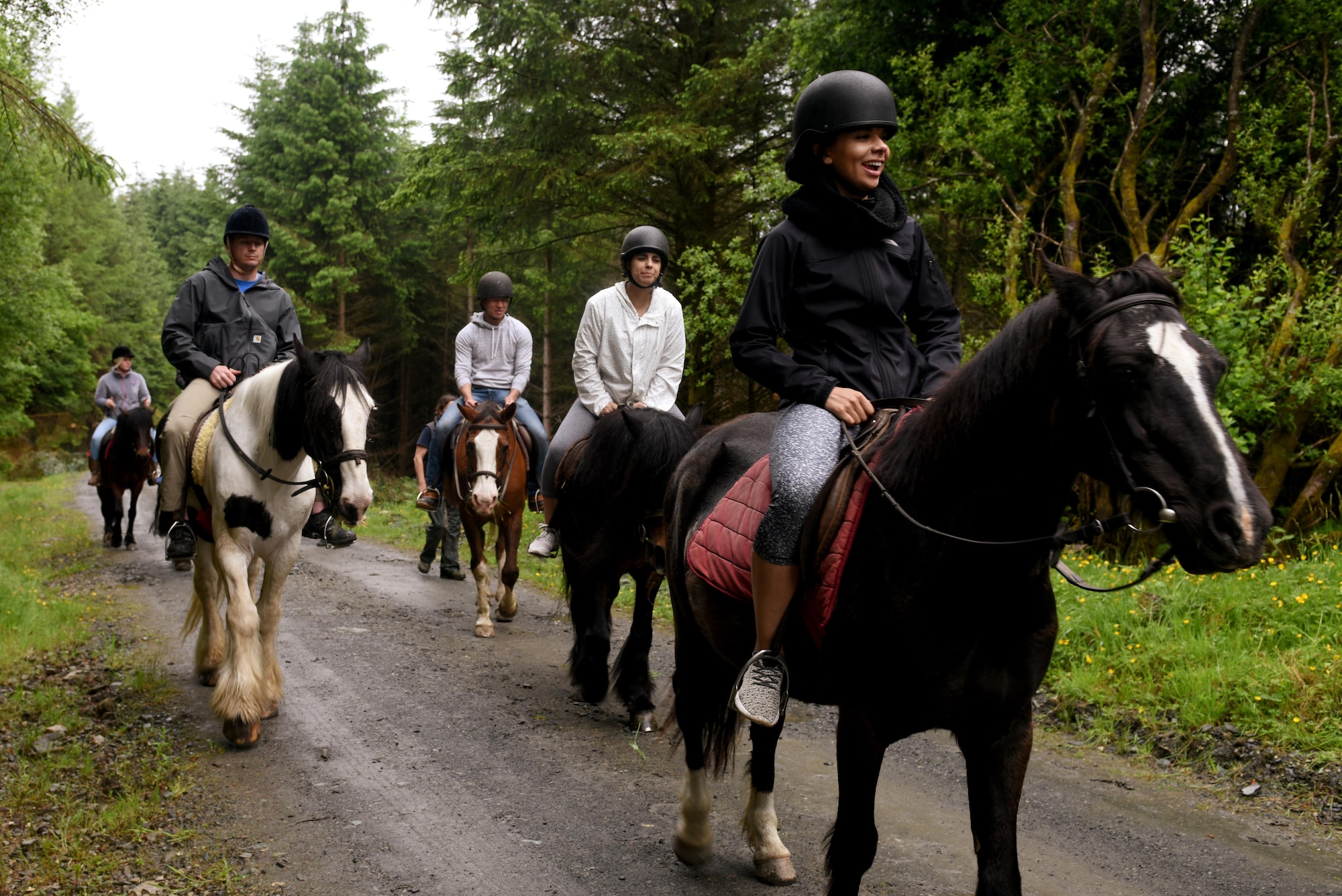 U.S. Air Force Airmen from Royal Air Force Lakenheath, England ride horses through the forest during a chapel-sponsored resiliency trip to Gwydyr Stables in Betws-y-Coed, Wales, May 29. The trip was for first-term single Airmen to work toward resiliency goals and to build friendships with other Airmen. (U.S. Air Force photo by Airman 1st Class John A. Crawford)