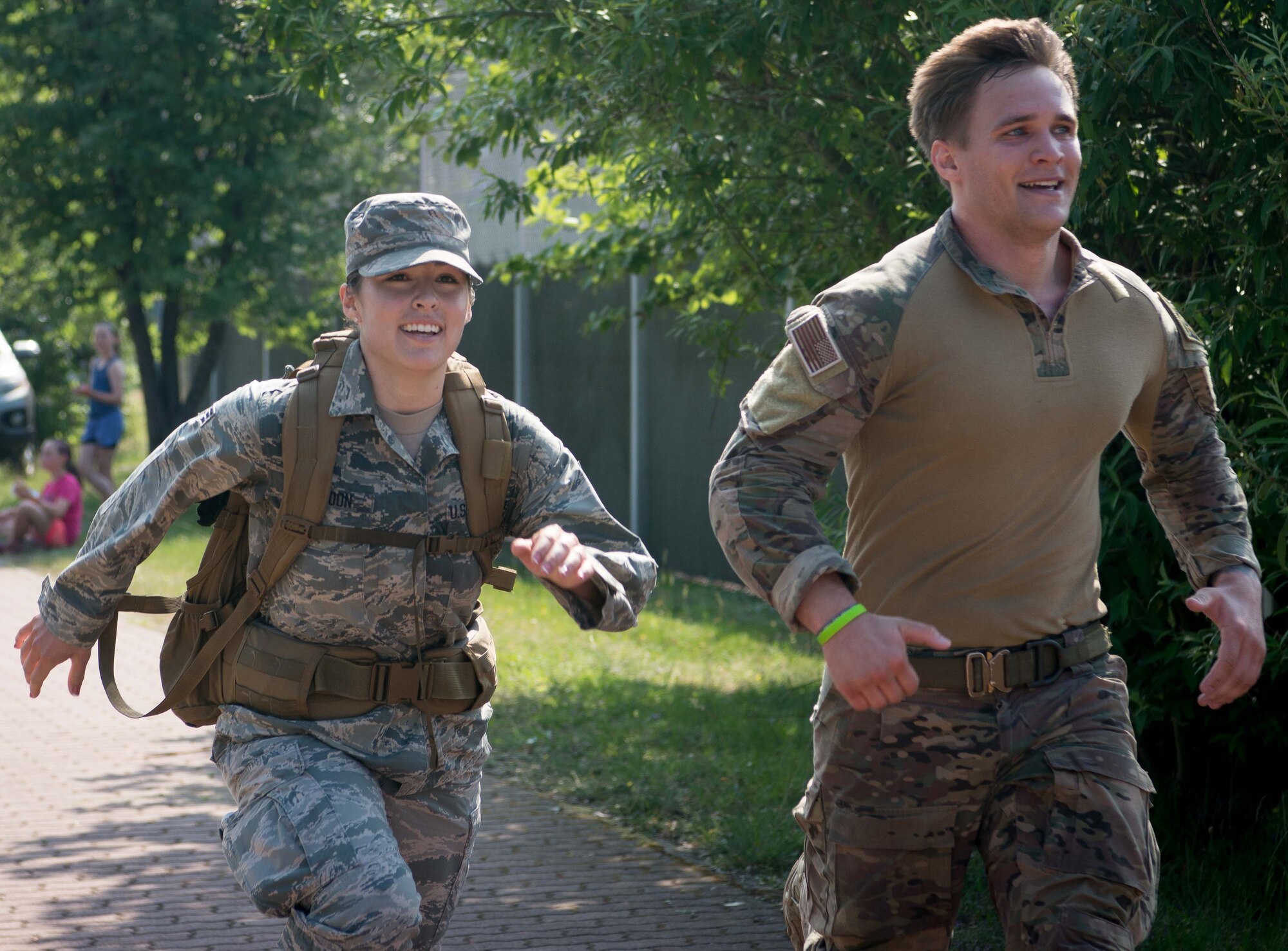 Participants of the Second Annual Chief Master Sgt. of the Air Force Paul Airey Memorial 10K ruck, head for the finish line on Ramstein Air Base, June 2, 2017. Former Chief Master Sgt. of the Air Force, Paul Airey served as a B-24 aerial gunner during World War II. After crashing on enemy territory and becoming a prisoner of war, Airey and other prisoners of war were forced to march approximately 400 miles across Germany, after which Airey was eventually rescued. (U.S. Air Force photo by Airman 1st Class Elizabeth Baker)