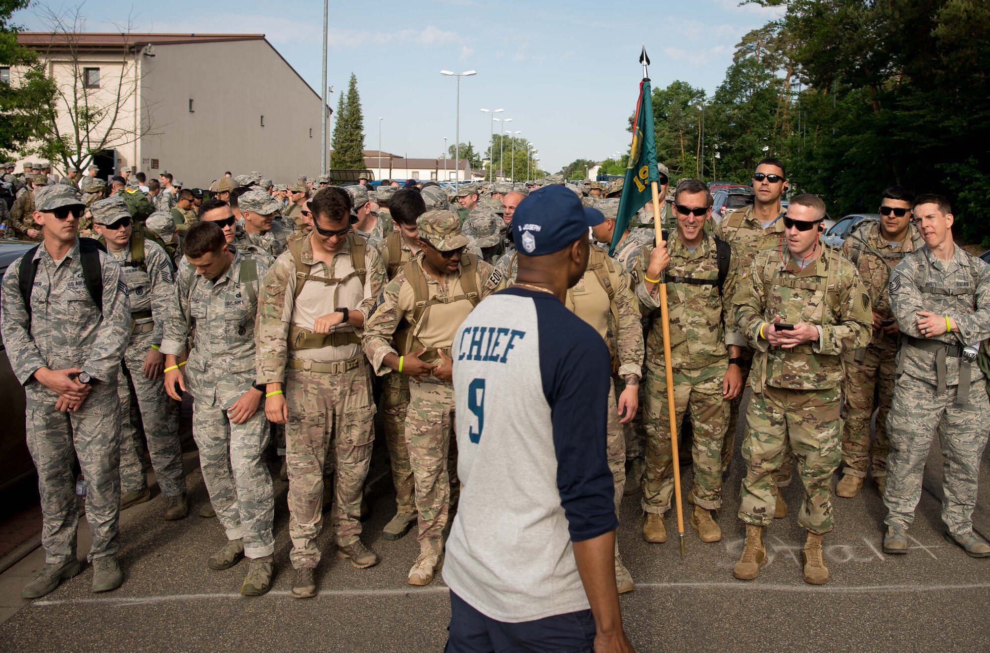 U.S. Airmen wait to begin a 10K ruck during the Second Annual Chief Master Sgt. of the Air Force Paul Airey Memorial Ruck/March/Run on Ramstein Air Base, June 2, 2017. Approximately 500 Airmen participated in the memorial events, including a 5K and 10K run or walk and a 10K ruck with 1st, 2nd, and 3rd place prizes. Proceeds from the event went to the Air Force Enlisted Village, a community in Florida supporting spouses of enlisted Airmen. (U.S. Air Force photo by Airman 1st Class Elizabeth Baker)