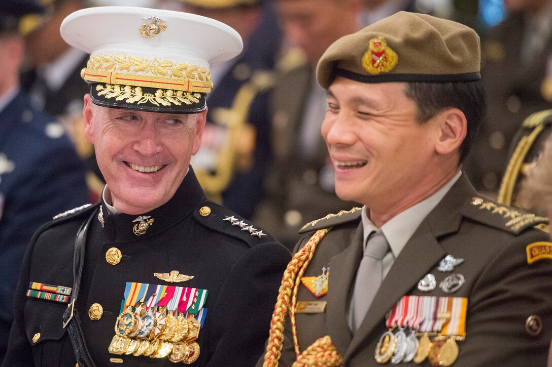 Marine Corps Gen. Joe Dunford, chairman of the Joint Chiefs of Staff, shares a laugh during a ceremony in which he received an award from Singapore President Tony Tan Keng Yam at the Istana, Singapore, June 2, 2017. Dunford is in Singapore to attend the Shangri-La Dialogue, an Asia-focused defense summit. DoD photo by Navy Petty Officer 2nd Class Dominique A. Pineiro