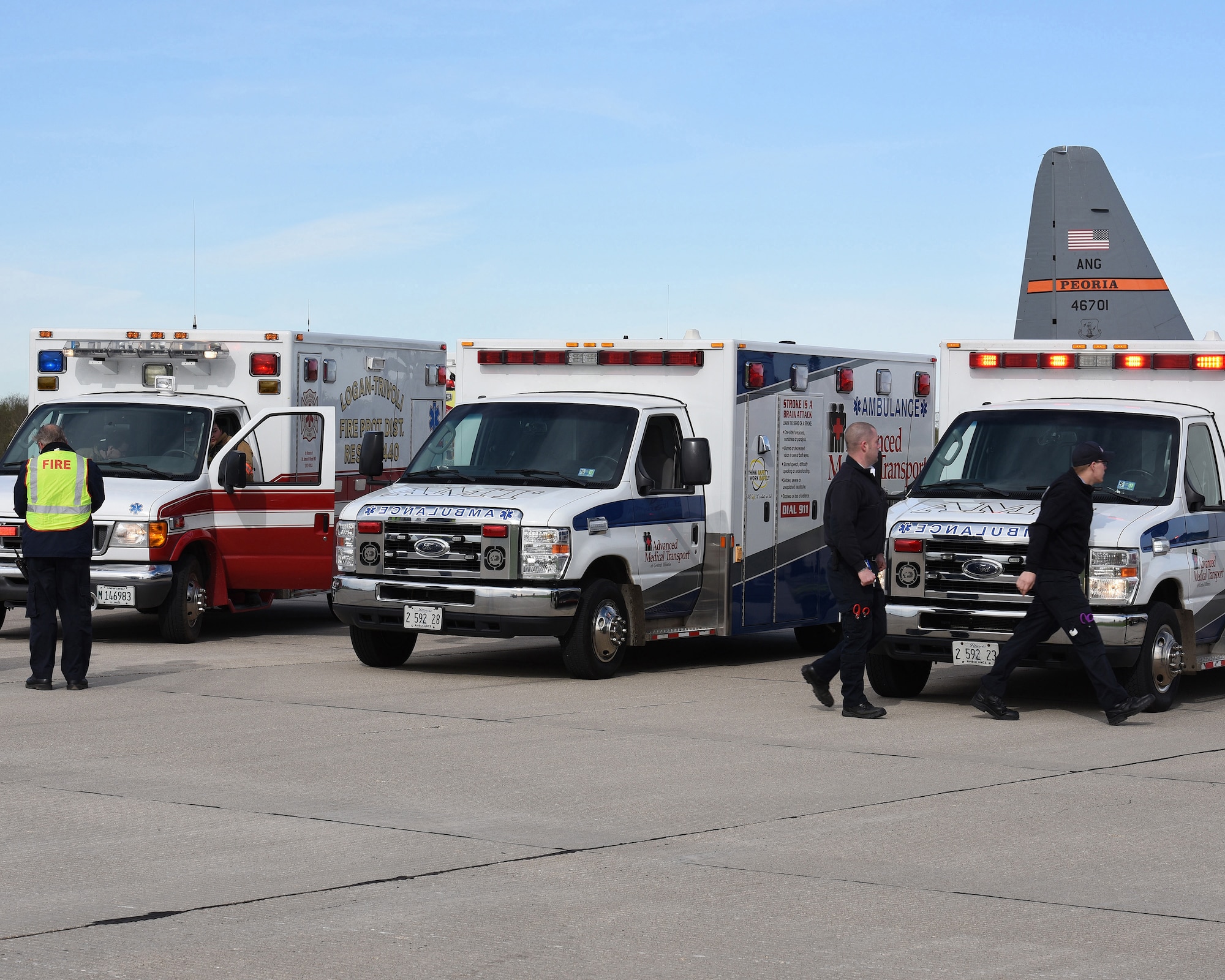 Ambulances from Advanced Medical Transport and Logan-Trivoli Fire Protection District stage to receive victims from a simulated airliner crash at the General Wayne A. Downing Peoria International Airport in Peoria, Ill. April 22, 2017.  Thirty-eight agencies and over 200 exercise participants took part in the full-scale mass casualty exercise. (U.S. Air National Guard photo by Master Sgt. Todd Pendleton)