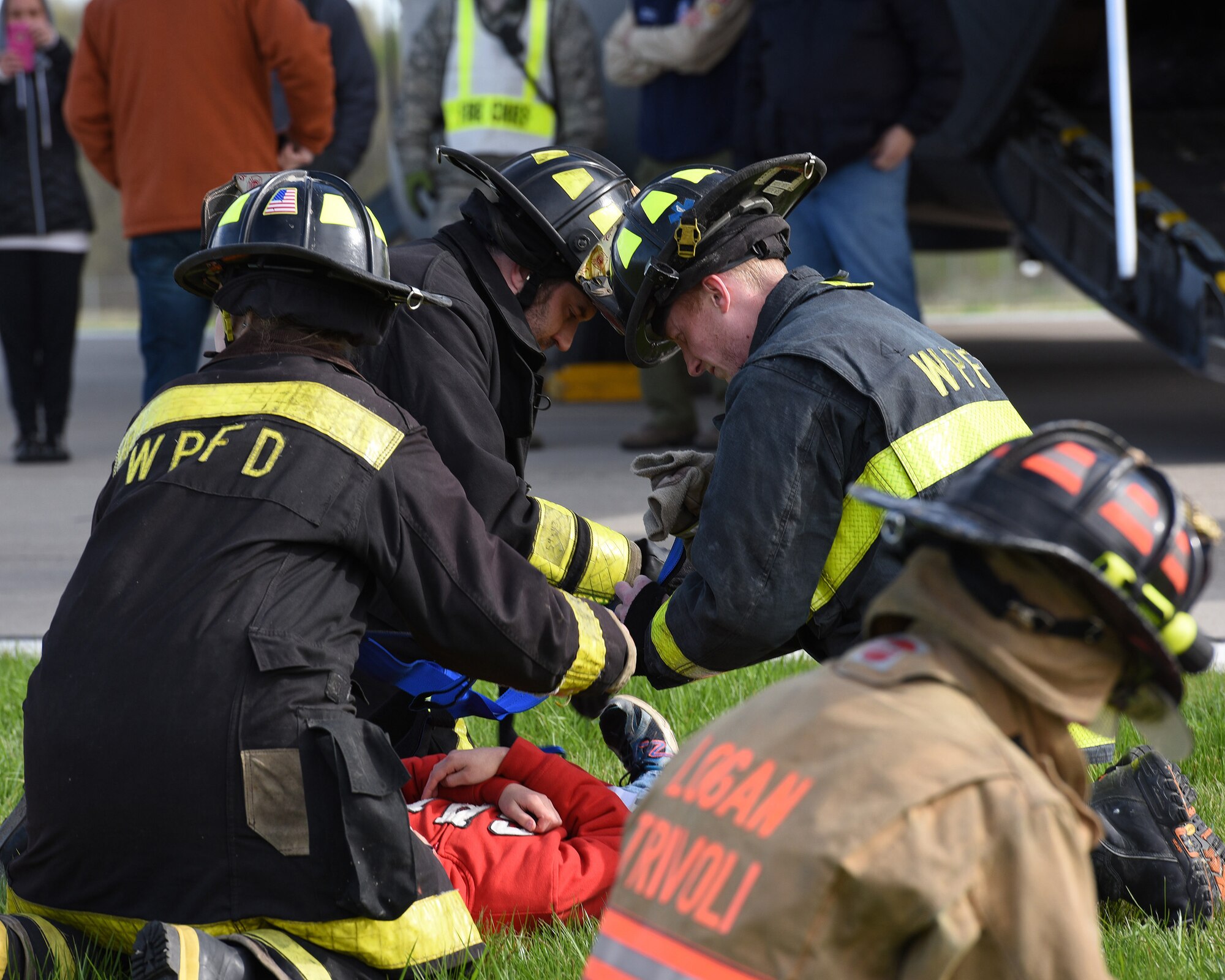 Firefighters from Logan-Trivoli Fire Protection District and West Peoria Fire Protection District evaluate the conditions of victims of a simulated aircraft crash at the General Wayne A. Downing Peoria International Airport in Peoria, Ill. April 22, 2017.  Thirty-eight agencies and more than 200 exercise participants took part in the full-scale mass casualty exercise. (U.S. Air National Guard photo by Master Sgt. Todd Pendleton)