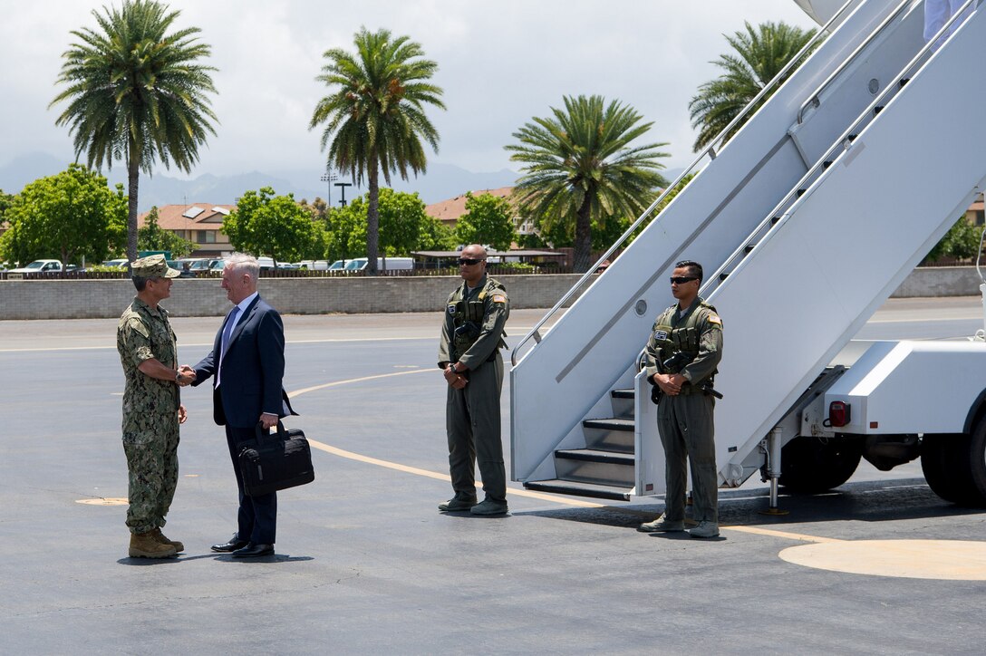 Defense Secretary Jim Mattis is greeted by Navy Adm. Harry B. Harris Jr., commander of U.S. Pacific Command, upon his arrival at Joint Base Pearl Harbor-Hickam, Hawaii, on the stop of an overseas trip, May 31, 2017. DoD photo by Air Force Staff Sgt. Jette Carr