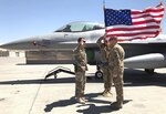 Capt. Andrew Calloway (right), financial services flight commander for the 502nd Comptroller Squadron, pinned on his captain’s bars far from home May 29 while deployed to the 455th Expeditionary Maintenance Group as the group’s executive officer.