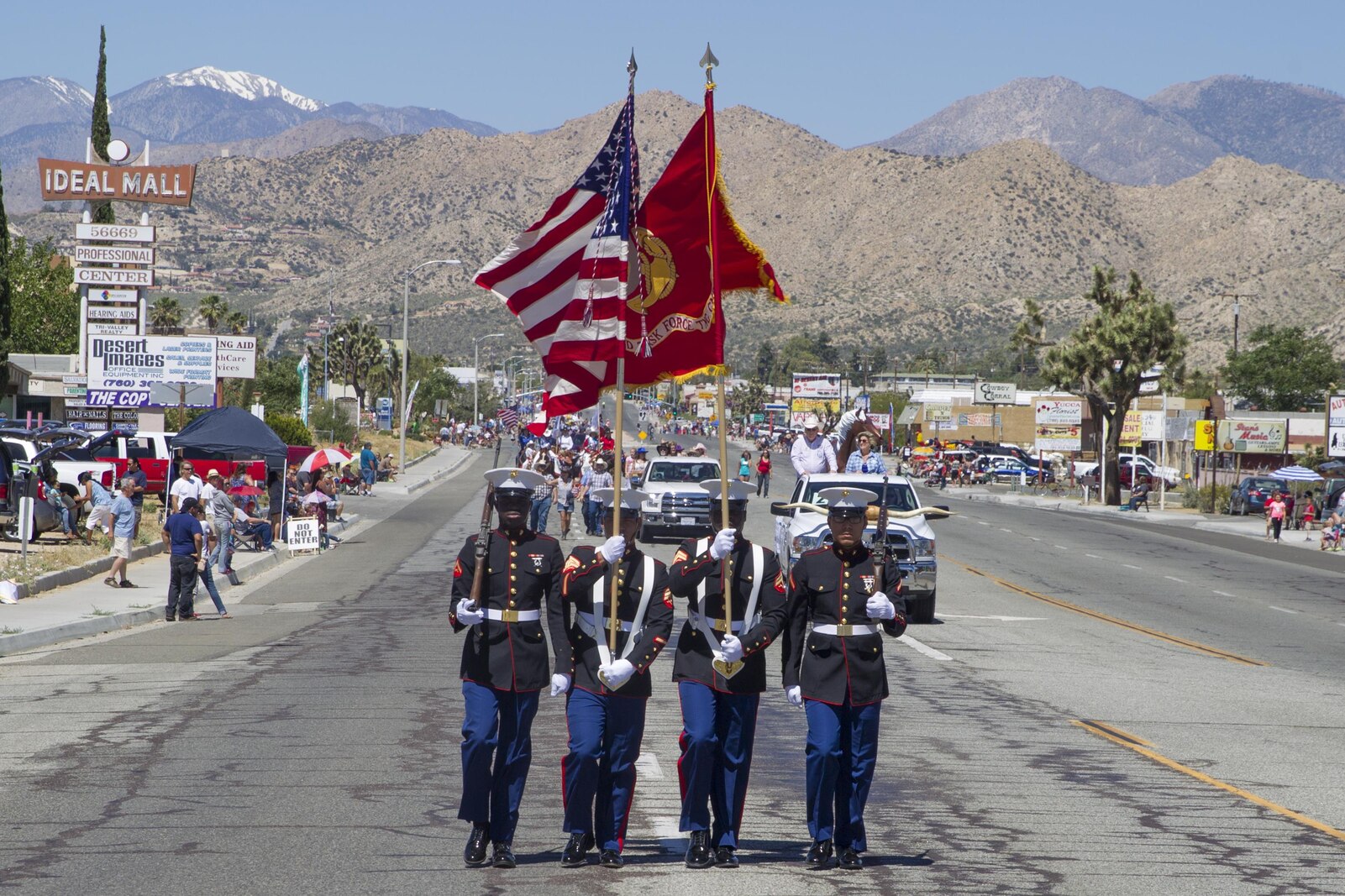 The Combat Center Color Guard leads the parade during the 67th annual Grubstake Days Parade along California Highway 62 in Yucca Valley, California.