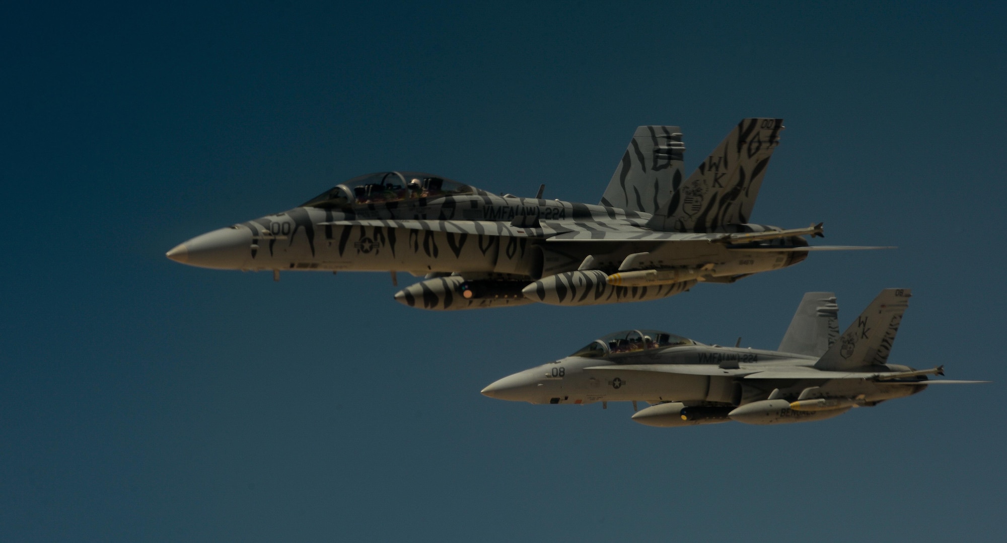 Two U.S. Marine Corps F-18 Super Hornets depart after receiving fuel from a 908th Expeditionary Air Refueling Squadron KC-10 Extender during a flight in support of Operation Inherent Resolve May 31, 2017. The Super Hornet is capable across the full mission spectrum: air superiority, fighter escort, reconnaissance, aerial refueling, close air support, air defense suppression and day and night precision strike. (U.S. Air Force photo by Staff Sgt. Michael Battles)