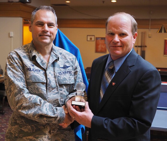 Col. (Ret.) Cam LeBlanc (right) accepts the Order of the Global Vikings award from Col. Tony Polashek, 934th Airlift Wing commander, at a ceremony May 24.  The annual award recognizes individuals for their outstanding support and commitment to the 934th Airlift Wing and the Air Force Reserve. (Air Force Photo/Paul Zadach)