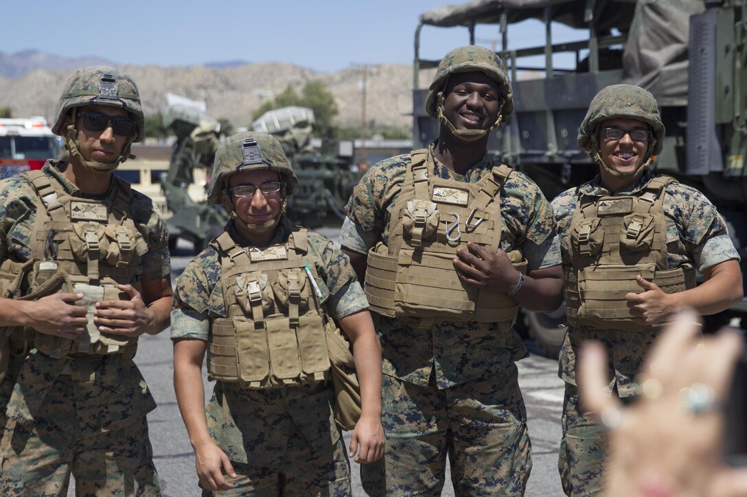 Marines with 3rd Light Armored Reconnaissance Battalion pose for a spectator’s photo during the 67th annual Grubstake Days Parade along California Highway 62 in Yucca Valley, Calif., May 27, 2017. The town holds the annual Grubstake Days festival to commemorate the mining heritage of the Yucca Valley community. (U.S. Marine Corps photo by Sgt. Connor Hancock)