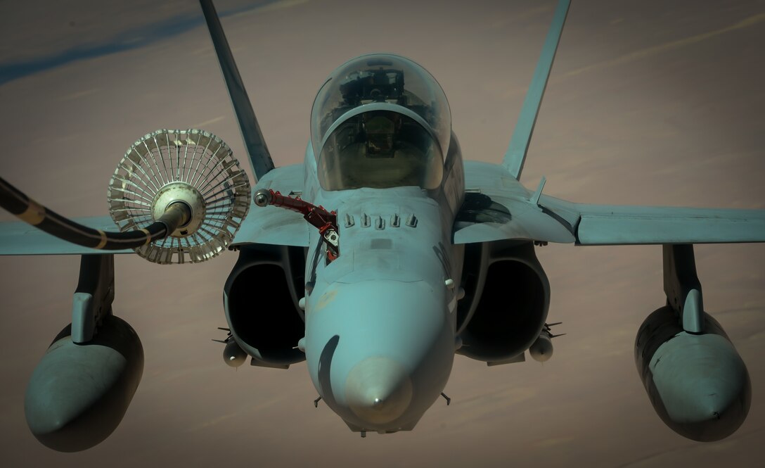 A U.S. Marine Corps F-18 Super Hornet receives fuel from a 908th Expeditionary Air Refueling Squadron KC-10 Extender during a flight in support of Operation Inherent Resolve May 31, 2017. The Super Hornet is capable across the full mission spectrum: air superiority, fighter escort, reconnaissance, aerial refueling, close air support, air defense suppression and day and night precision strike. (U.S. Air Force photo by Staff Sgt. Michael Battles)