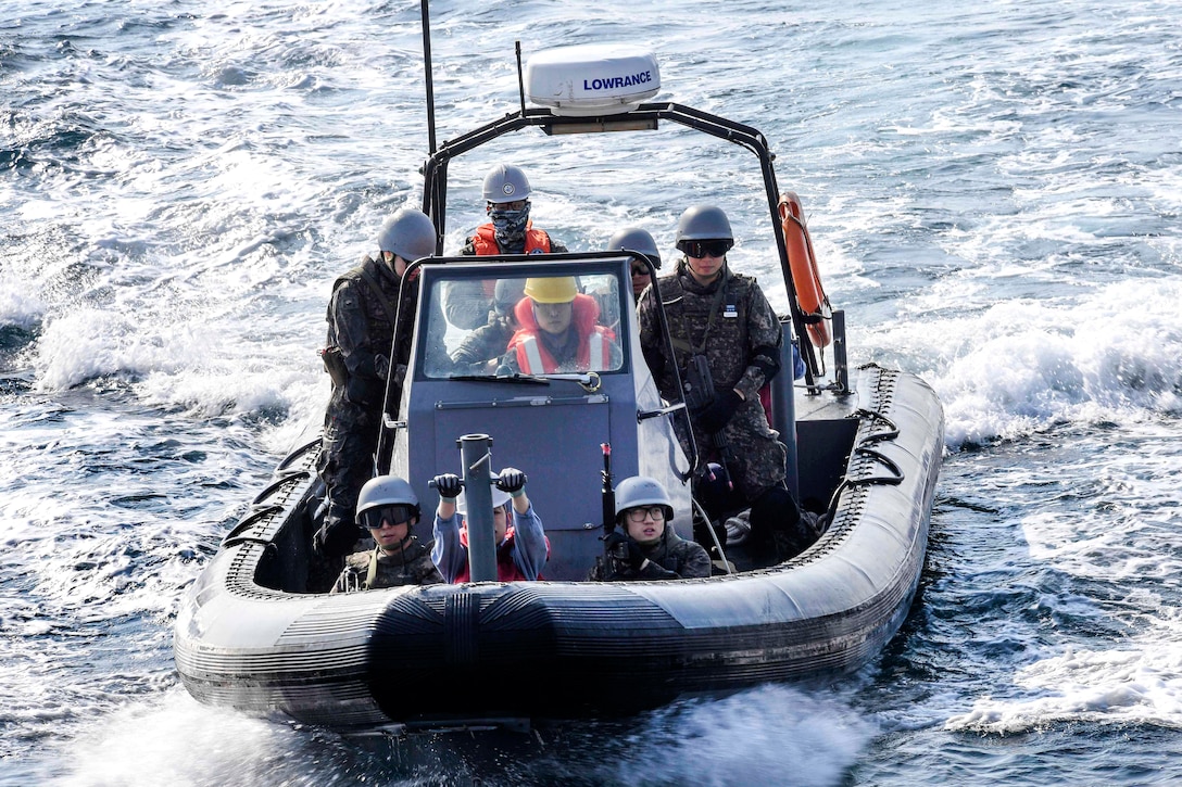 South Korean sailors in a rigid-hull inflatable boat pull alongside the USS Wayne E. Meyer in the western Pacific Ocean, May 22, 2017, during visit, board, search and seizure training. The Meyer is deployed with the Carl Vinson Carrier Strike Group as part of the U.S. Pacific Fleet-led initiative to extend U.S. 3rd Fleet command and control functions into the Indo-Asia-Pacific region. Navy photo by Petty Officer 3rd Class Kelsey L. Adams 