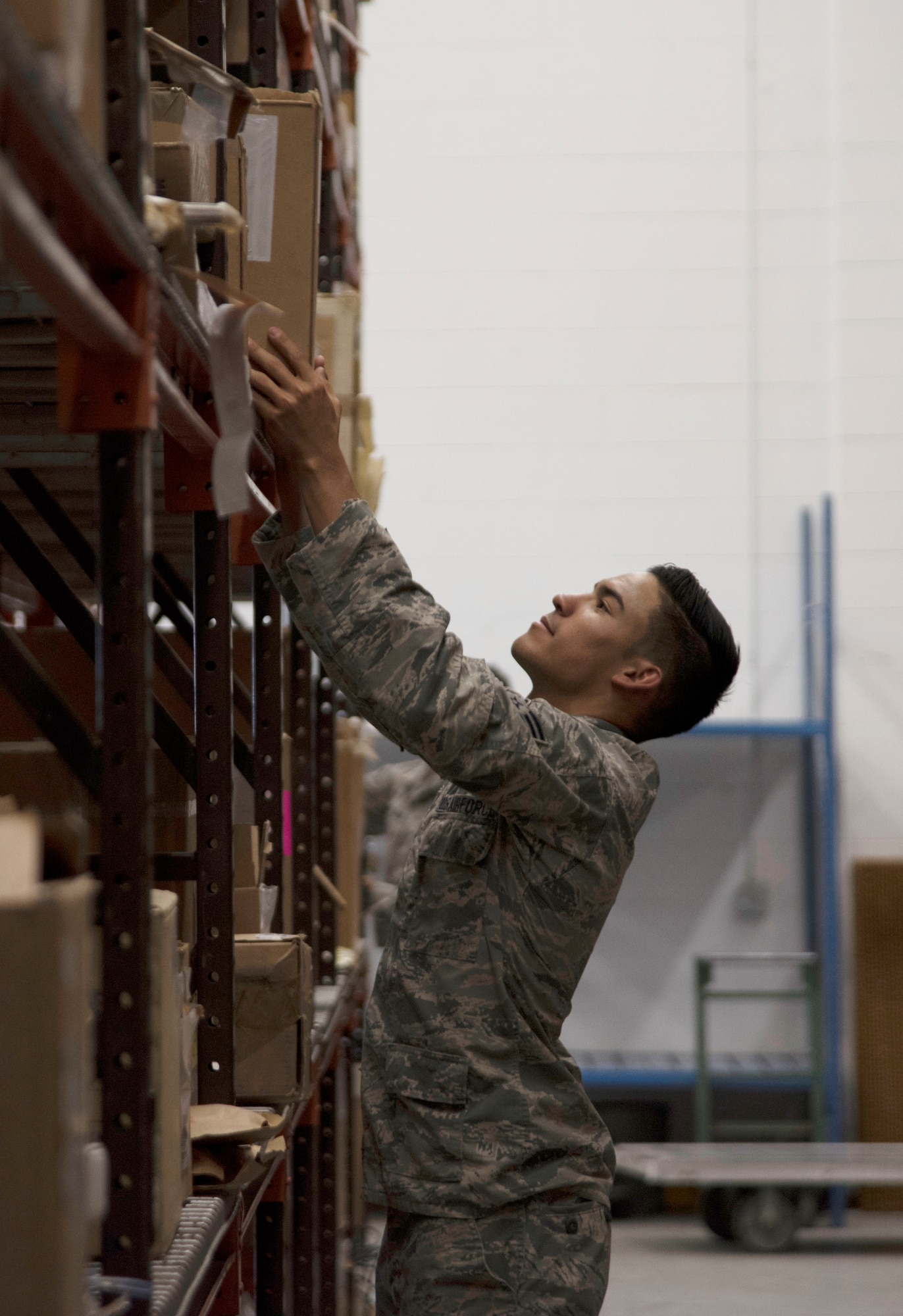 U.S. Air Force Senior Airman Jerod Garcia, an inventory technician assigned to the 6th Logistics Readiness Squadron processes an aircraft part package in the aircraft supply warehouse at MacDill Air Force Base, Fla., June 1, 2017. Supply Airmen are responsible for maintaining supplies used for installation support as well as aircraft maintenance. (U.S. Air Force photo by Airman 1st Class Adam R. Shanks)