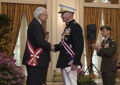 Marine Corps Gen. Joseph F. Dunford Jr., chairman of the Joint Chiefs of Staff, speaks with the President of Singapore Tony Tan after receiving an award at the Istana, June 2, 2017. Dunford is in Singapore to attend the Shangri-La Dialogue, an Asia-focused defense summit, where he will meet with regional allies and counterparts to discuss common security issues. 