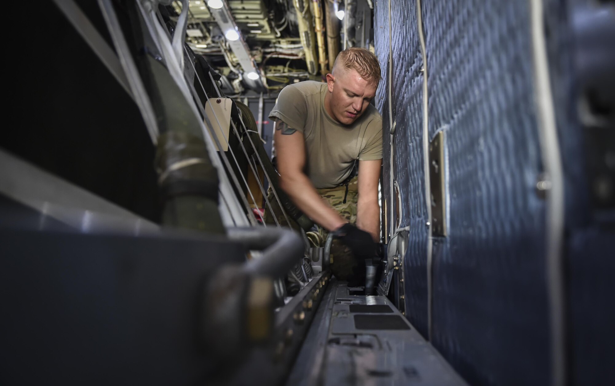 Staff Sgt. Josh Kindell, a loadmaster with the 15th Special Operations Squadron, sets the lock tension of cargo pallets on an MC-130H Combat Talon II at Hurlburt Field, Fla., May 30, 2017.The lock tension properly secures cargo until it is airdropped. (U.S. Air Force photo by Airman 1st Class Joseph Pick)