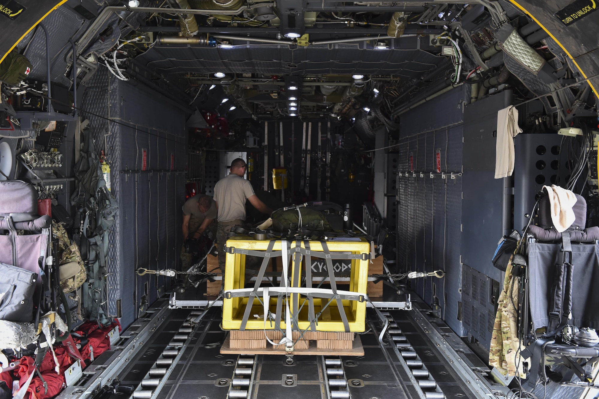 Loadmasters with the 15th Special Operations Squadron secure cargo pallets on an MC-130H Combat Talon II at Hurlburt Field, Fla., May 30, 2017. Loadmasters are responsible for properly loading, securing and escorting cargo and passengers before and during flights. (U.S. Air Force photo by Airman 1st Class Joseph Pick)