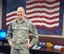 On May 24 in his Wright-Patterson Air Force Base office, Lt.Gen Robert D.McMurry, commander of the Air Force Life Cycle Management Center, stands in front of the American flag quilt his wife, De, made in memory of 9/11. McMurry took command of the single center responsible for total life cycle management covering all aircraft, engines, munitions and electronic systems on May 2. (U.S.Air Force photo/Brian Brackens)
