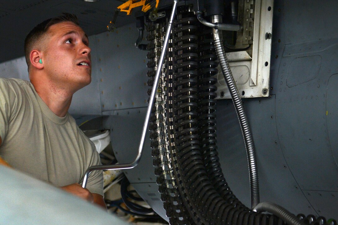 U.S. Air Force Airman 1st Class Armeni James, 20th Aircraft Maintenance Squadron weapons load crew member, loads munitions into an M61A1 Vulcan 20 mm rotary cannon during the annual Weapons Load Crew of the Year competition at Shaw Air Force Base, S.C., May 31, 2017. During the competition, crews loaded a GBU-31 bomb, AIM-9M and AIM-9X Sidewinder missiles, and the cannon onto an F-16CM Fighting Falcon. (U.S. Air Force photo by Airman 1st Class Christopher Maldonado)