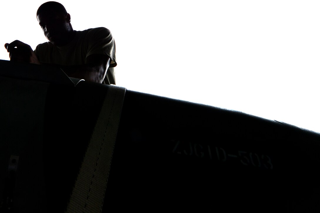 U.S. Air Force Senior Airman Travis Jones, 20th Aircraft Maintenance Squadron weapons load crew member, inspects a GBU-31 version one bomb during the annual Weapons Load Crew of the Year competition at Shaw Air Force Base, S.C., May 31, 2017. Airmen inspect all munitions prior to securing them onto a bomb loader to increase efficiency and speed. (U.S. Air Force photo by Airman 1st Class Christopher Maldonado)