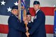 U.S. Air Force Lt. Col. James Buessing, incoming 77th Fighter Squadron (FS) commander, receives the 77th FS “Gamblers” guidon from Col. Douglas Thies, 20th Operations Group commander, during a change of command ceremony at Shaw Air Force Base, S.C., June 2, 2017. Buessing has over 1,900 flying hours, including more than 260 combat hours over Iraq and Afghanistan. (U.S. Air Force photo by Airman 1st Class Christopher Maldonado)