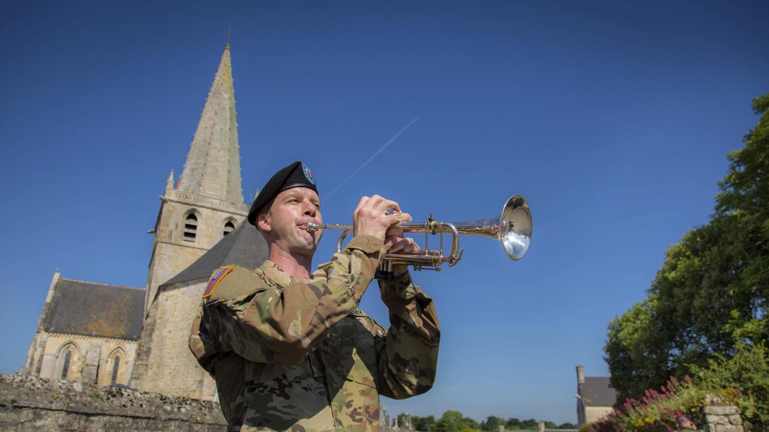 Army Sgt. Jonathan Bosarge performs taps during a ceremony commemorating the 73rd anniversary of D-Day in Picauville, France, June 1, 2017. Army photo by Spc. Joseph Agacinski