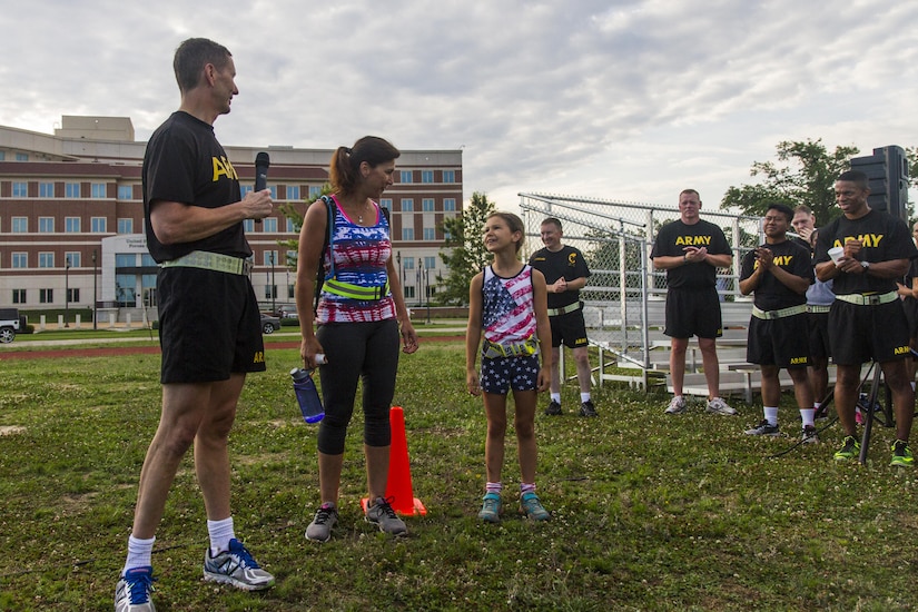 Maj. Gen. David Conboy, Deputy Commanding General (Operations) for the U.S. Army Reserve Command, with his wife Karen Conboy and his daughter Clare Conboy, addresses the formation after an urban-orienteering event, at the USARC headquarters at Fort Bragg, N.C., June 2, 2017. The event was designed to promote individual and unit readiness by ensuring everybody stays physically fit, enhance team cohesion and improve spirit de corps.
Orienteering is a competitive form of land navigation. It combines map
reading, terrain study, strategy, competition and exercise. (U.S. Army
Reserve photo by Sgt. Stephanie Ramirez)
