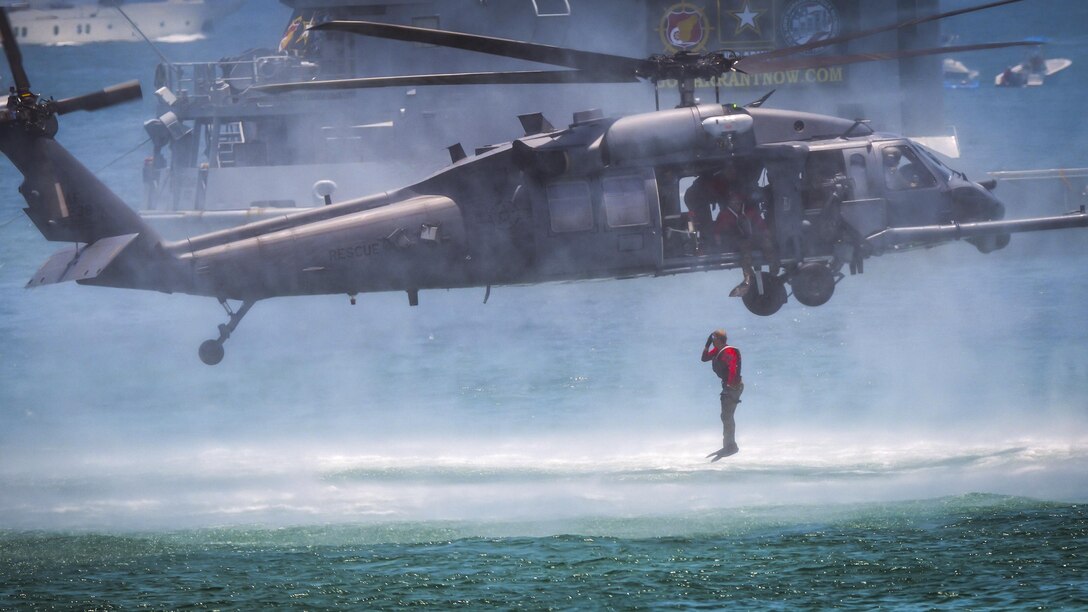 An Air Force pararescueman jumps from an HH-60G Pave Hawk helicopter during the National Salute to America’s Heroes Air and Sea Show in Miami Beach, Fla., May 27, 2017. The airman is assigned to the 920th Rescue Wing. Air Force photo by Senior Airman Brandon Kalloo Sanes