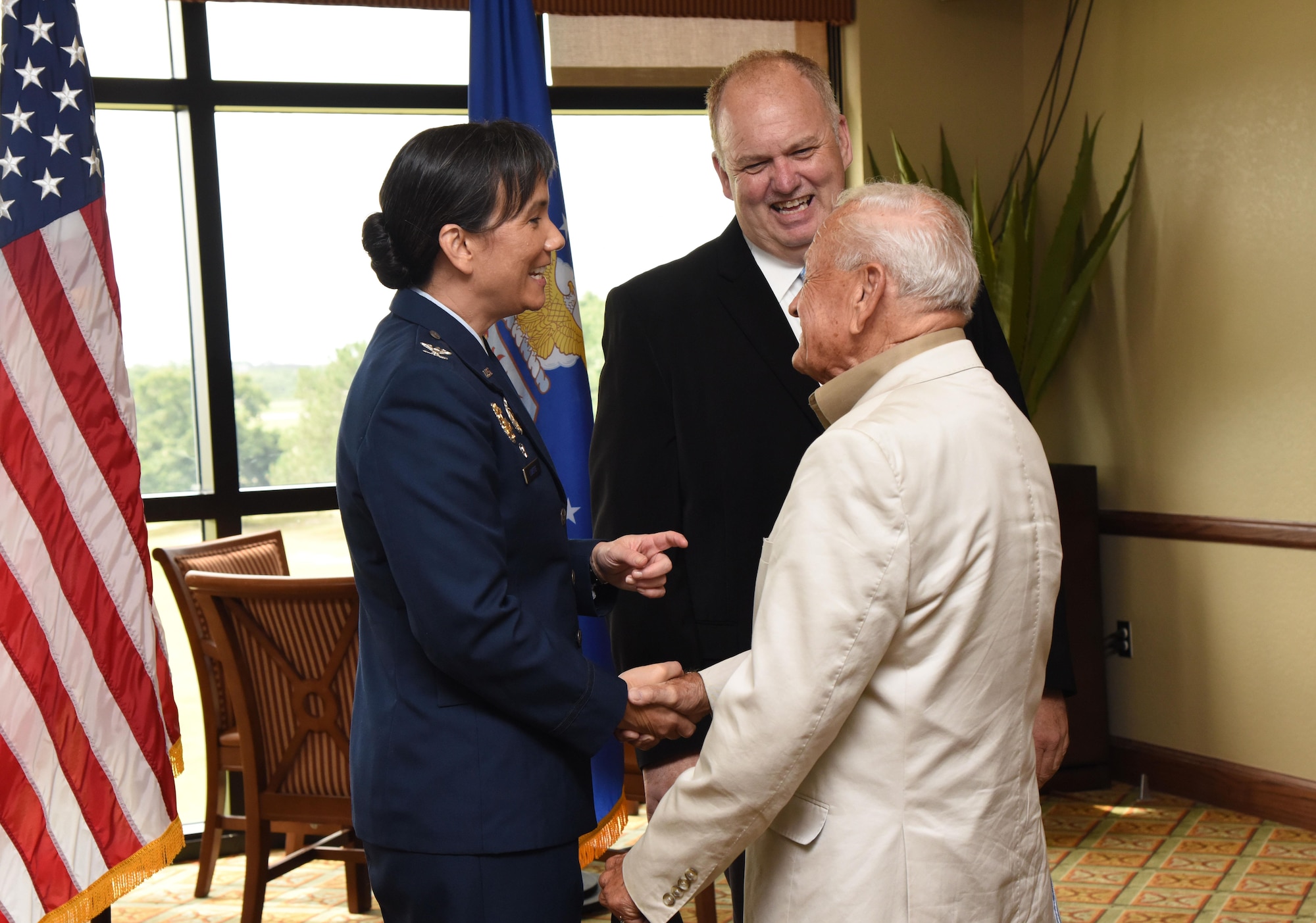 Col. Debra Lovette, 81st Training Wing commander, is greeted by retired Lt. Col. Dick Wilson during a change of command ceremony reception at the Bay Breeze Event Center June 2, 2017, on Keesler Air Force Base, Miss. Lovette assumed command from Col. Michele Edmondson. (U.S. Air Force photo by Kemberly Groue)