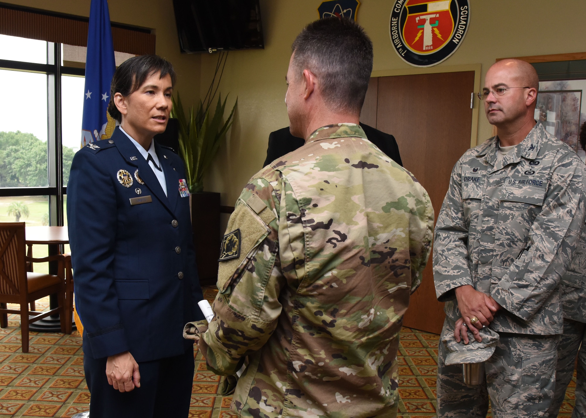 Col. Debra Lovette, 81st Training Wing commander, is greeted by U.S. Army Lt. Col. Glen Flowers, 1108th Theater Aviation Sustainment Maintenance Group commander, Mississippi Army National Guard, during a change of command ceremony reception at the Bay Breeze Event Center June 2, 2017, on Keesler Air Force Base, Miss. Lovette assumed command from Col. Michele Edmondson. (U.S. Air Force photo by Kemberly Groue)