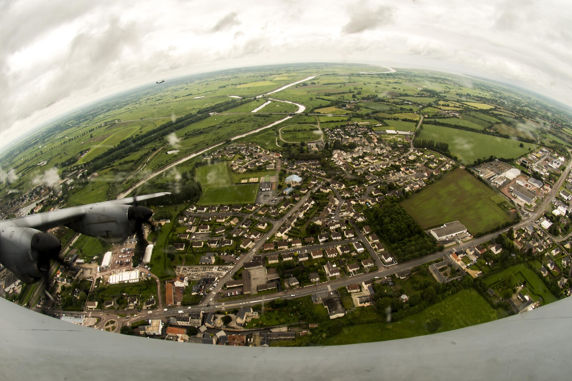 A U.S. Air Force C-130J Super Hercules assigned to the 37th Airlift Squadron, Ramstein Air Base, Germany, flies over Normandy, France, May 30, 2017, in preparation to commemorate D-Day 73, the largest multinational amphibious landing and operational military airdrop in history. Overall, approximately 400 U.S. service members from units in Europe and the U.S. are participating in ceremonial D-Day events from May 31 - June 7, 2017. (U.S. Air Force photo by Senior Airman Devin Boyer)