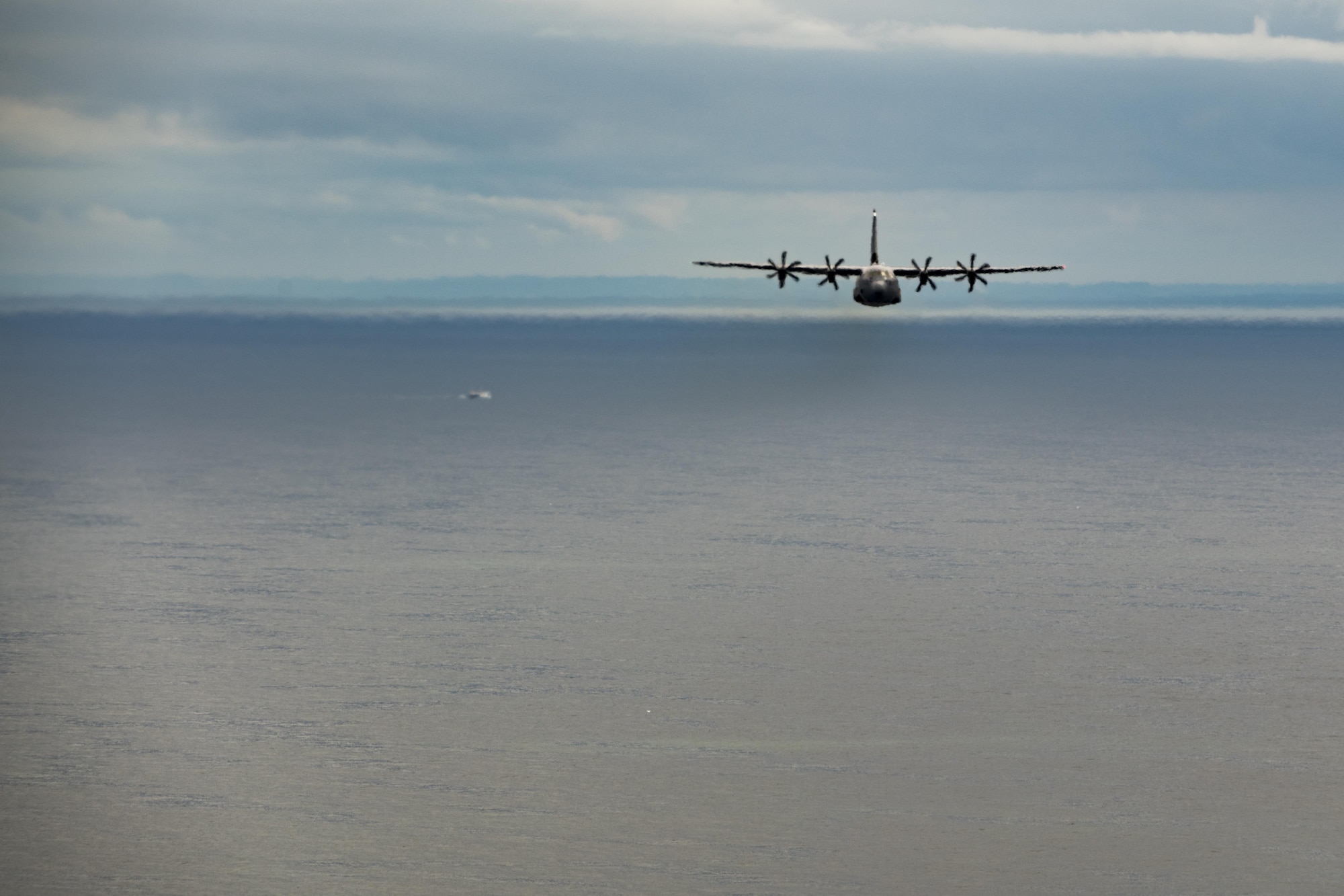 A U.S. Air Force C-130J Super Hercules assigned to the 37th Airlift Squadron at Ramstein Air Base, Germany, flies over the Atlantic Ocean near Normandy, France, May 30, 2017. The aircraft flew along the beaches of Normandy in preparation for commemorating D-Day 73, one of world history’s watershed moments. (U.S. Air Force photo by Senior Airman Devin Boyer)