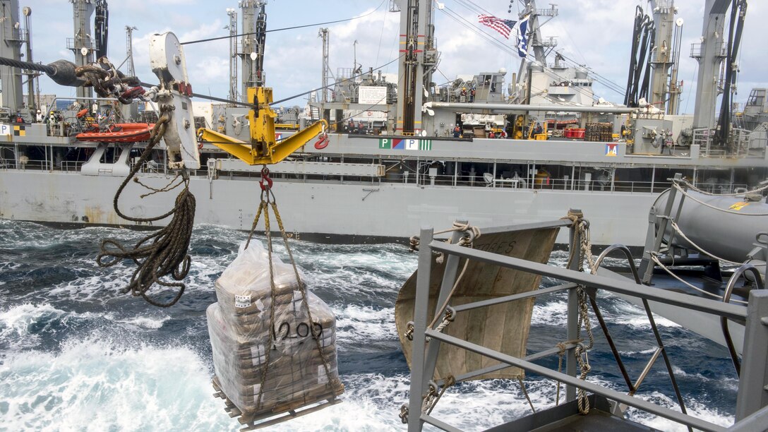 The guided-missile destroyer USS Mustin receives a pallet of supplies from the fleet replenishment oiler USNS Rappahannock during an underway replenishment in the Sea of Japan, May 26, 2017. The Mustin is on patrol supporting security and stability in the Indo-Asia-Pacific region. Navy photo by Petty Oficer 2nd Class William Collins III