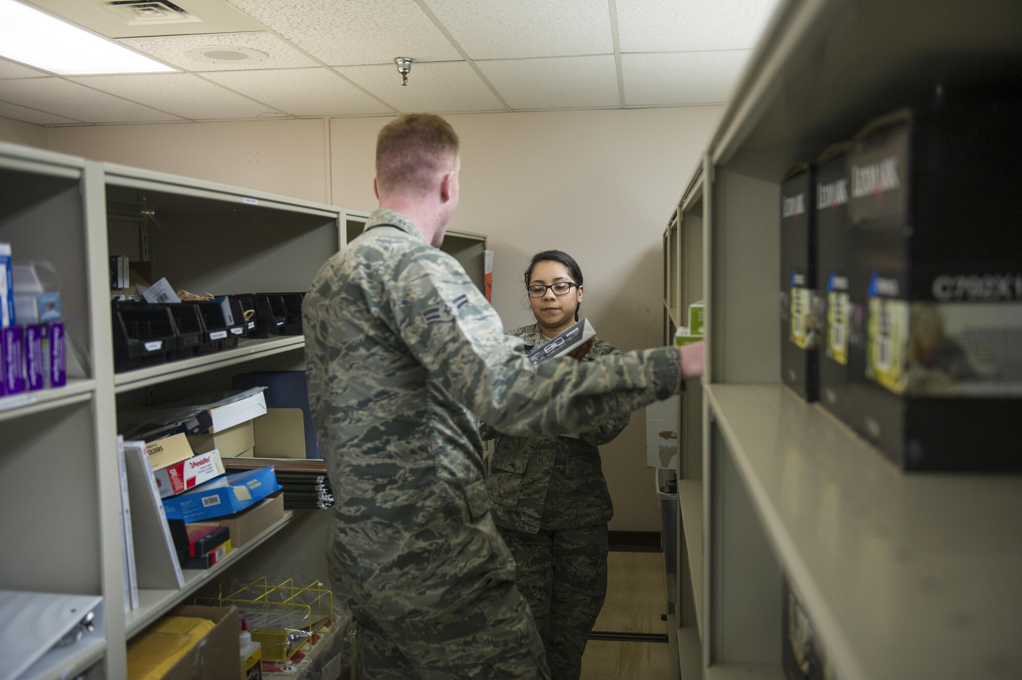 U.S. Air Force Airman 1st Class Genesis Rigg, a 354th Medical Support Squadron medical materials technician, gives supplies to Airman 1st Class Daniel Livesey a 354th Medical Operations Squadron health service journeyman June 2, 2017, at Eielson Air Force Base, Alaska. Medical material Airmen are responsible for ordering, receiving and storing different medical supplies. (U.S. Air Force photo by Airman 1st Isaac Johnson)

