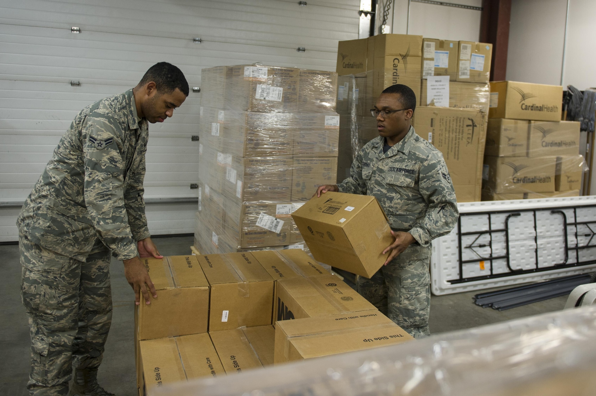 U.S. Air Force Airman 1st Class John Conyers, a 354th Medical Support Squadron medical materials technician, helps pack a pallet June 2, 2017, at Eielson Air Force Base, Alaska. Although they do not take care of patients, the medical materials flight is still essential to making sure the 354th Medical Group can provide patient care. (U.S. Air Force photo by Airman 1st Class Isaac Johnson)
