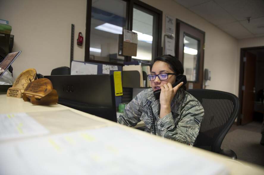 U.S. Air Force Airman 1st Class Genesis Rigg, a 354th Medical Support Squadron medical materials technician, speaks with someone about a supply order June 2, 2017, at Eielson Air Force Base, Alaska. Medical materials is responsible for ordering and receiving medical and non-medical supplies for their treatment facility. (U.S. Air Force photo by Airman 1st Class Isaac Johnson)