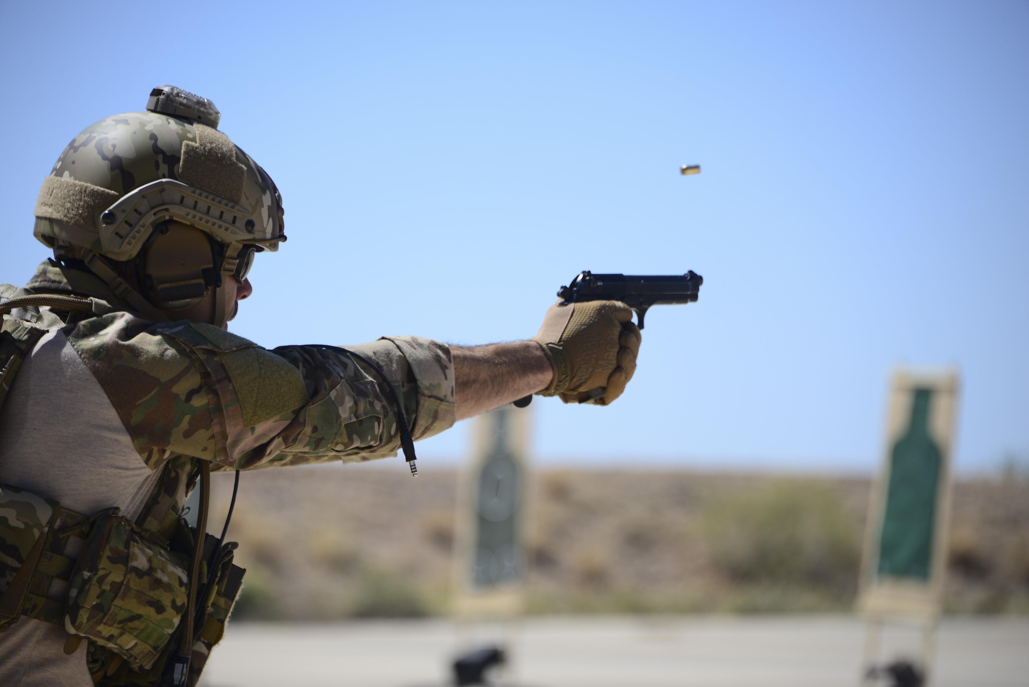 A U.S. Air Force pararescueman fires an M9 pistol at a target during the Guardian Angel Mission Qualification Training course at Davis-Monthan Air Force Base, Ariz., May 17, 2017. The MQT is a 90 day course that takes pararescuemen who have completed Air Education and Training Command schooling and helps them achieve their 5-level qualification. (U.S. Air Force photo by Airman 1st Class Nathan H. Barbour)