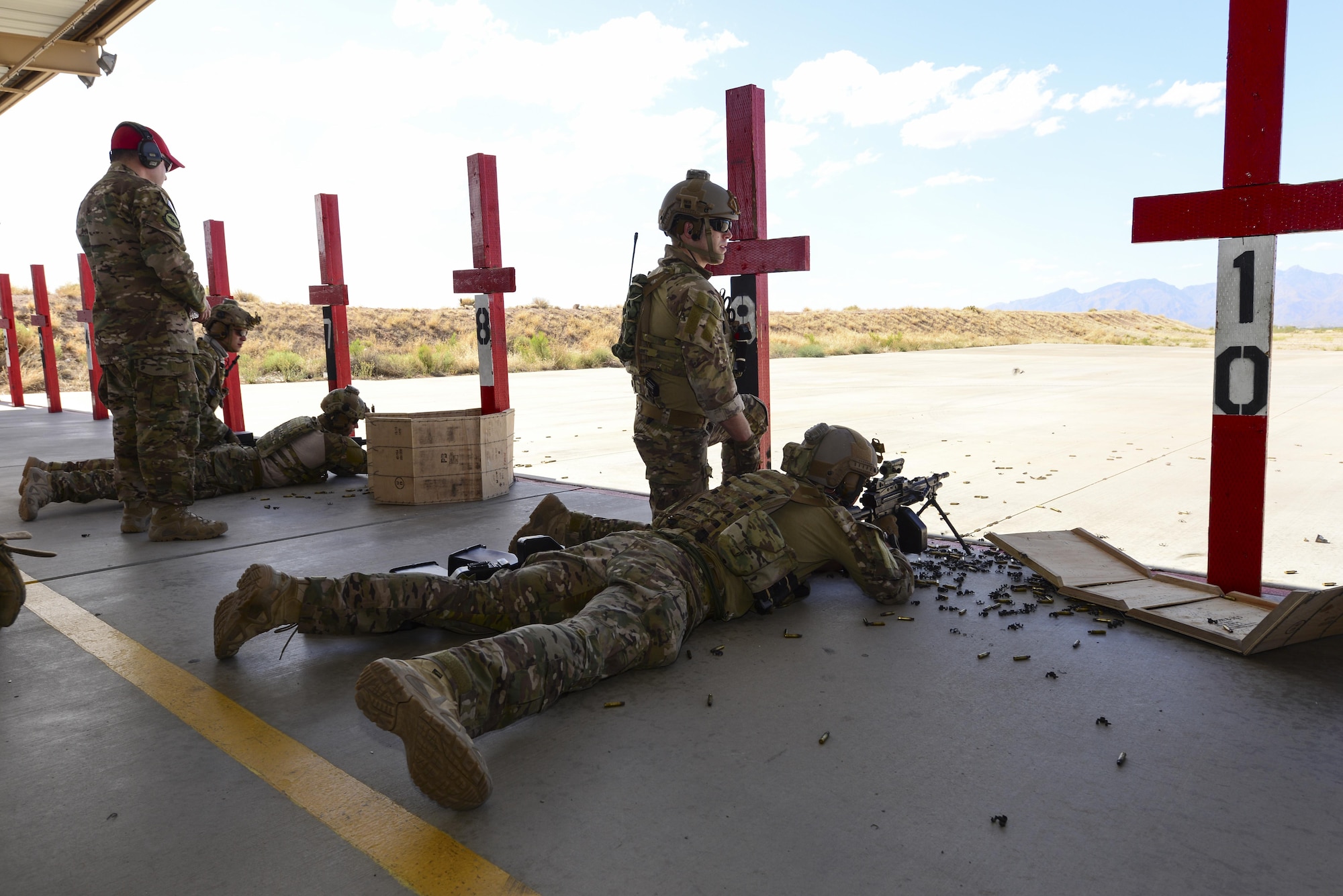 U.S. Air Force pararescuemen fire M249 automatic rifles during the Guardian Angel Mission Qualification Training course at Davis-Monthan Air Force Base, Ariz., May 18, 2017. The MQT is a 90 day course that takes pararescuemen who have completed Air Education and Training Command schooling and helps them achieve their 5-level qualification. (U.S. Air Force photo by Airman 1st Class Nathan H. Barbour)