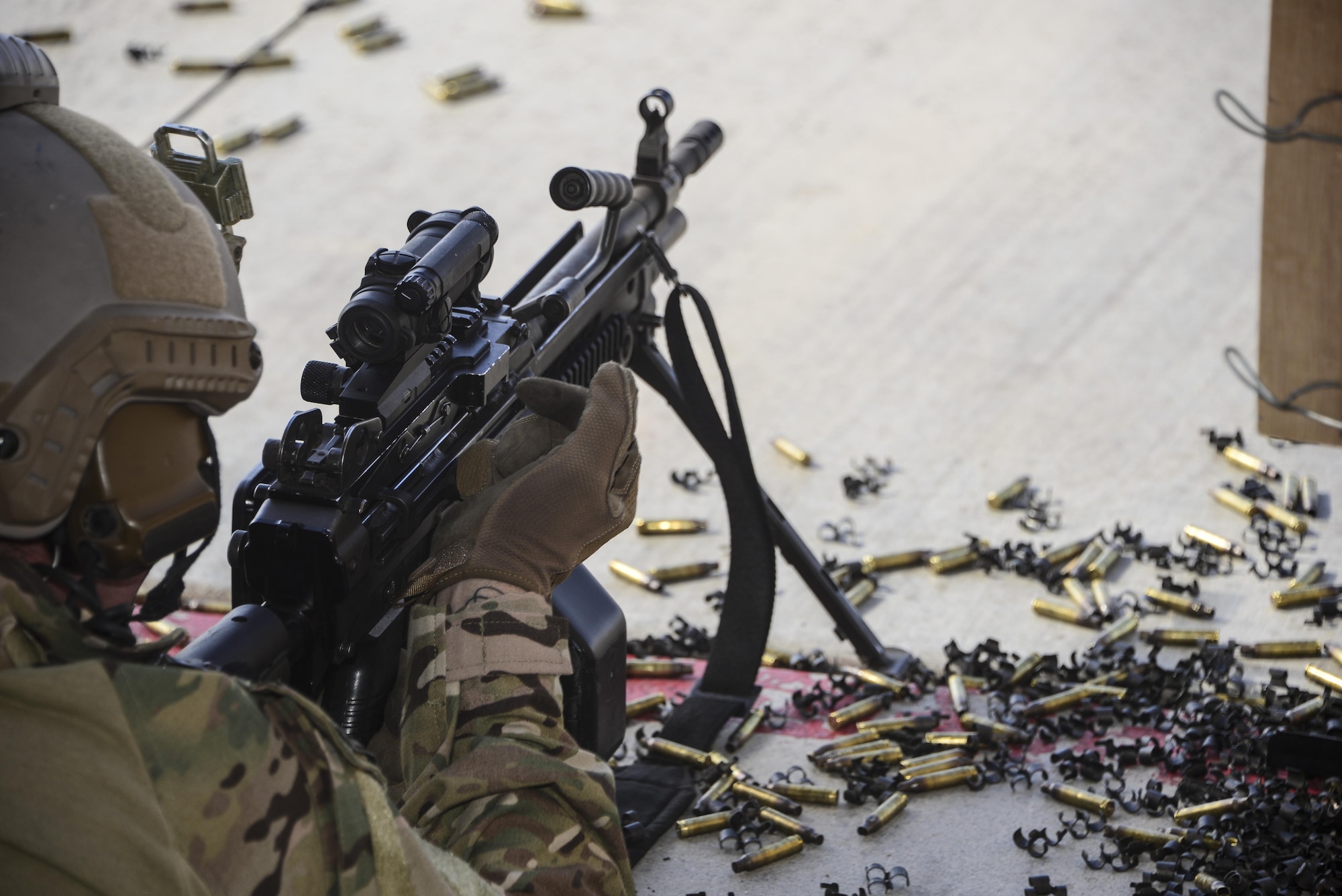 A U.S. Air Force pararescueman fires an M249 automatic rifle during the Guardian Angel Mission Qualification Training course at Davis-Monthan Air Force Base, Ariz., May 18, 2017. The MQT is a 90 day course that takes pararescuemen who have completed Air Education and Training Command schooling and helps them achieve their 5-level qualification. (U.S. Air Force photo by Airman 1st Class Nathan H. Barbour)