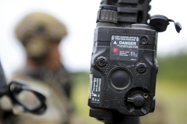 Members of the 1st Special Operations Security Forces Deployed Aircraft Ground Response Element use red laser sights during a shoot, move, communicate drill at Hurlburt Field, Fla., June 1, 2017. Red laser sights improve firing accuracy as opposed to using traditional iron sights. (U.S. Air Force photo by Airman 1st Class Dennis Spain)